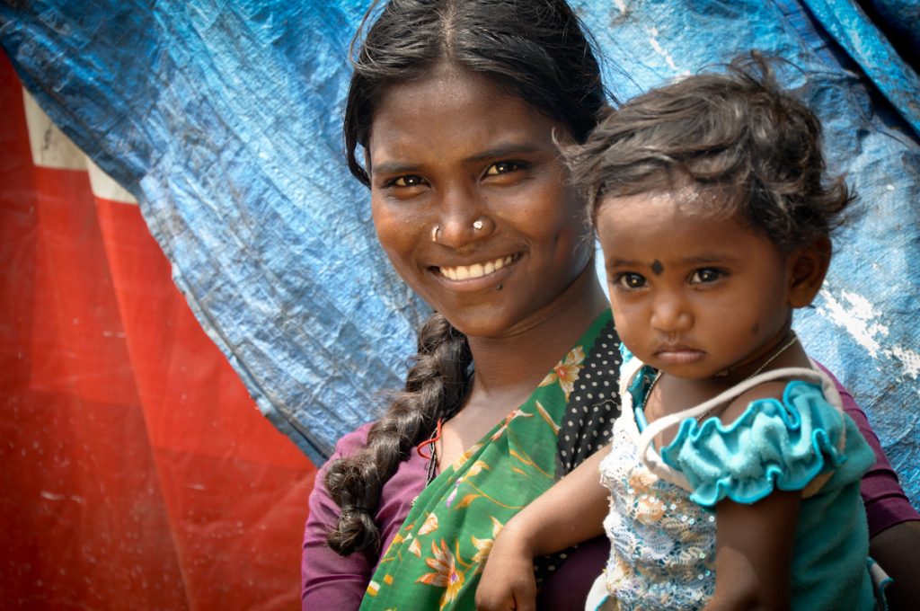 A mother with her little girl on the arm