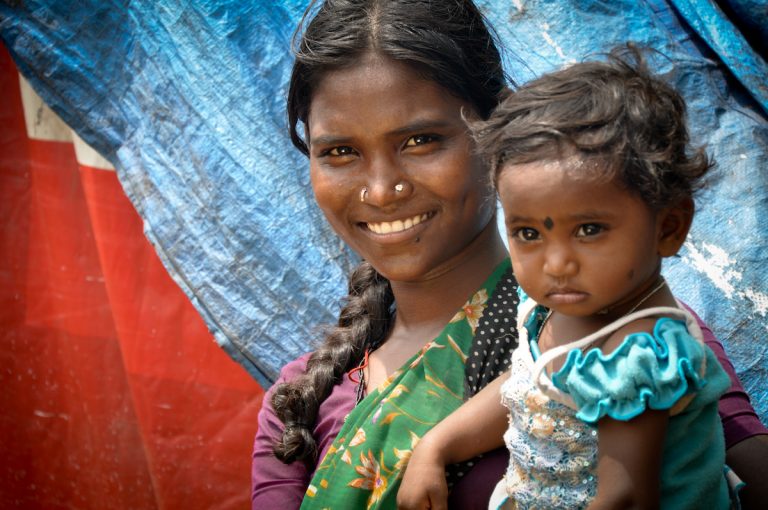 A mother with her little girl on the arm